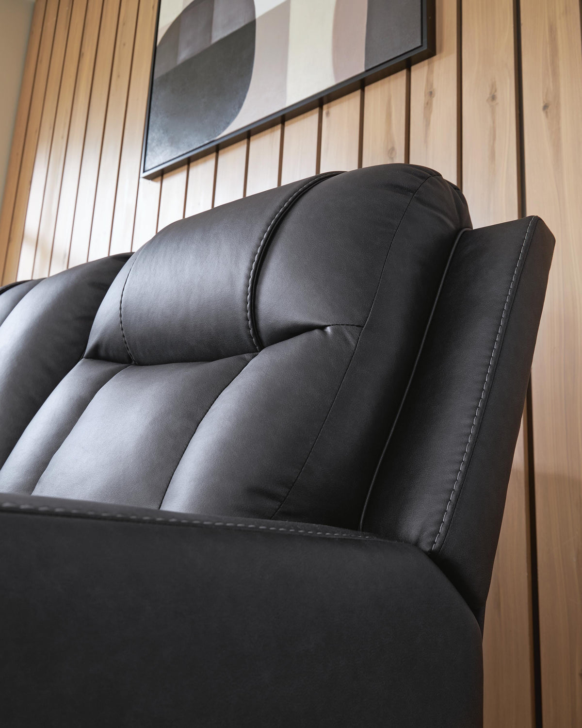 Mackmenville Reclining Loveseat with Console in Carbon, detail view