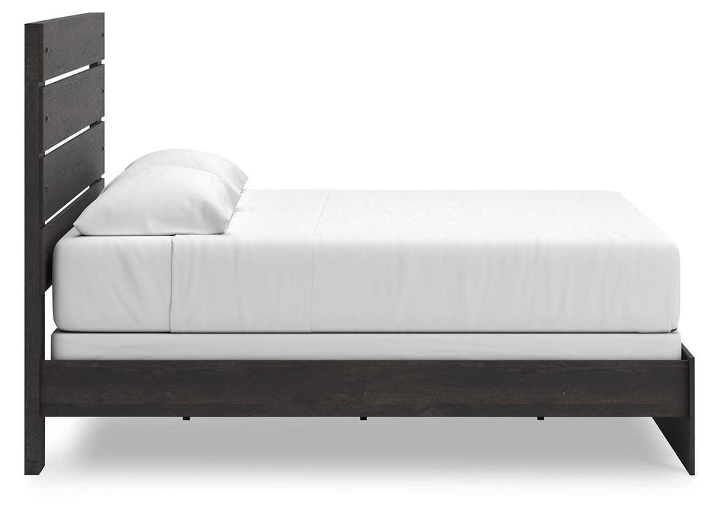 Delmorta King Panel Bed, Dresser, Mirror, Chest and Nightstand side view