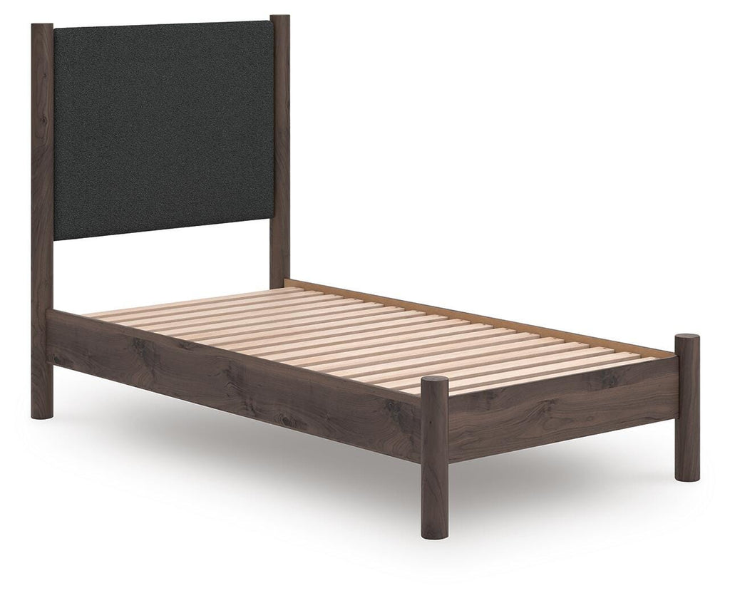 Pamytta Twin Upholstered Panel Platform Bed in Brown, angle view