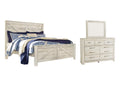 Bellaby King Crossbuck Panel Bed with Mirrored Dresser
