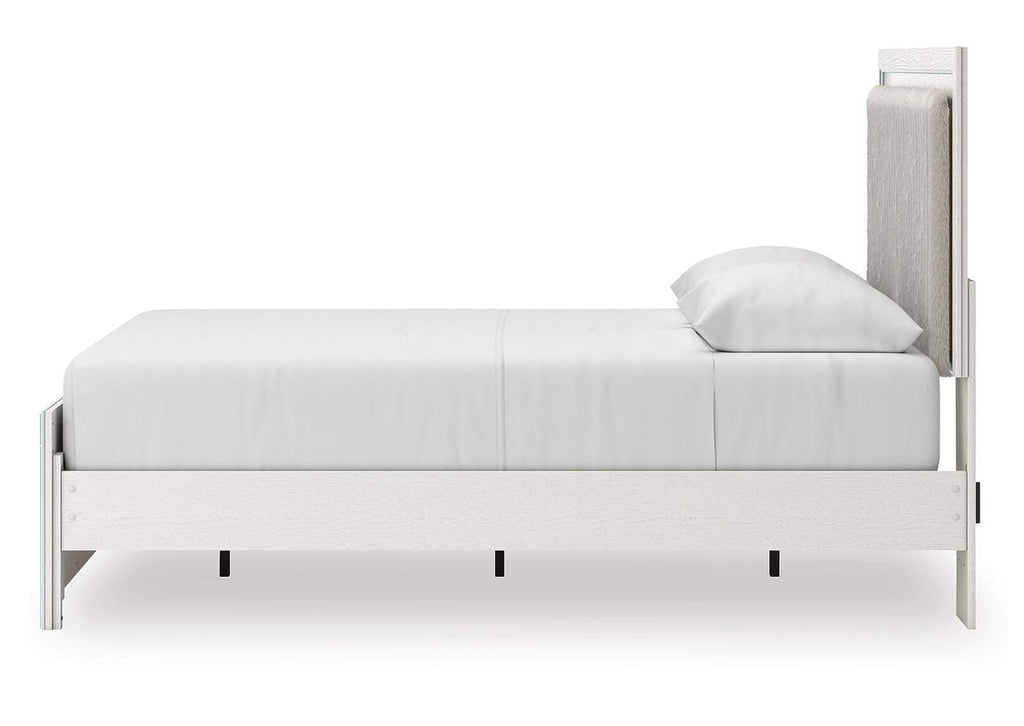 Birmonton Queen Upholstered Panel Platform Bed, Dresser and Nightstand side view