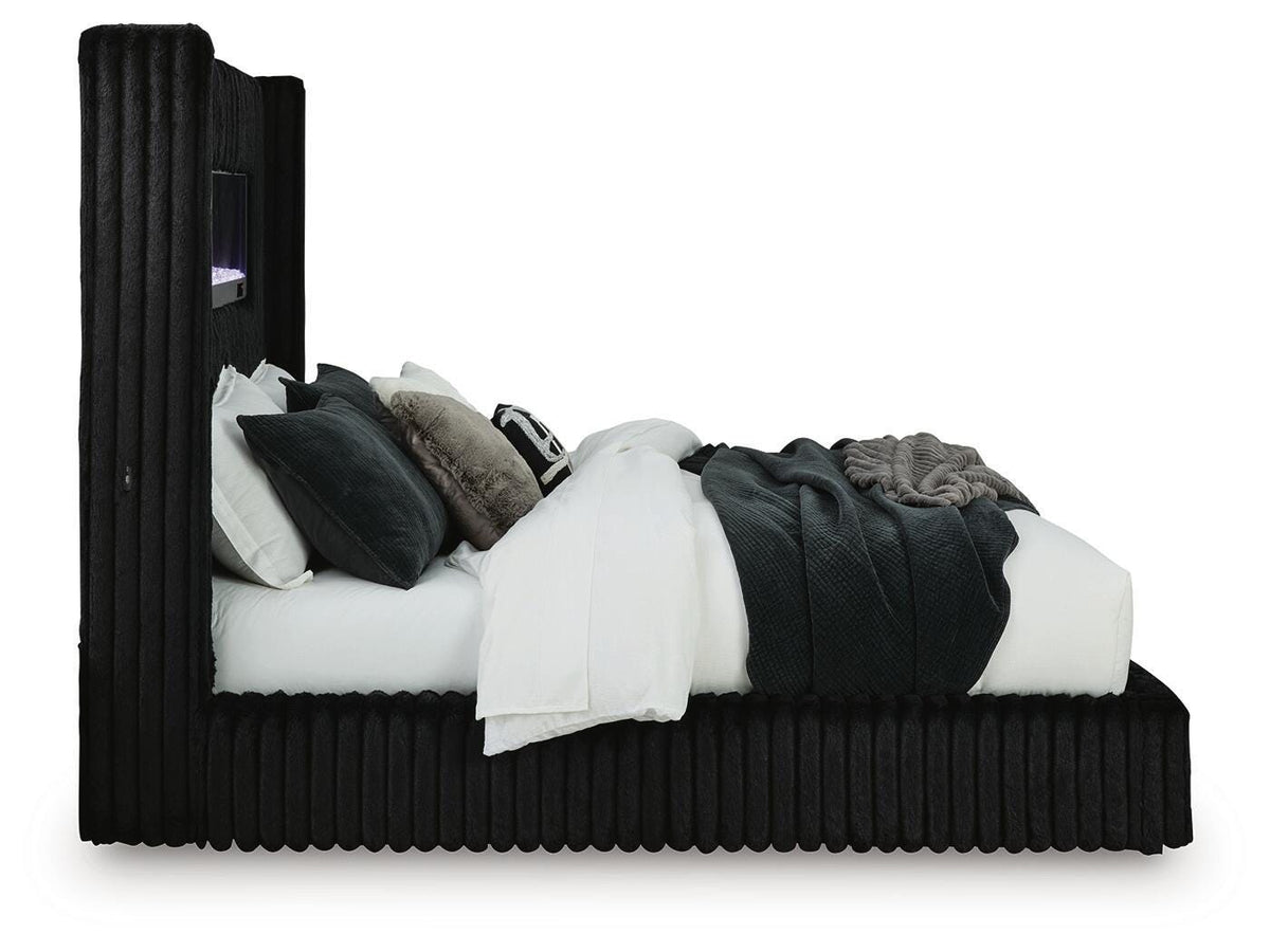 Tayleena King Upholstered Bed with Fireplace and Wireless Audio in Black, side view