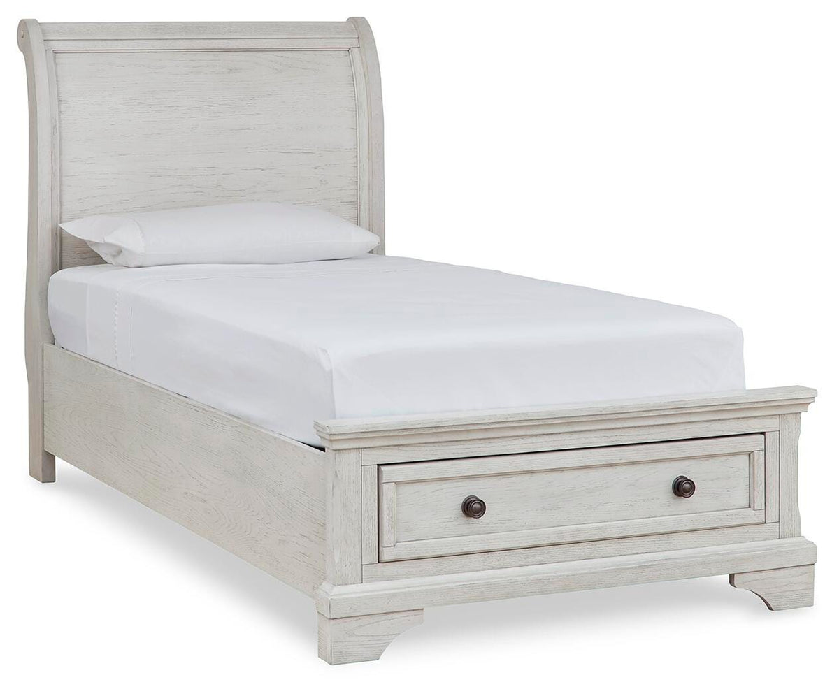 Robbinsdale Twin Sleigh Storage Bed in Antique White, angle view