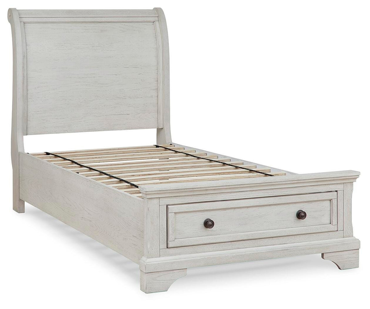 Robbinsdale Twin Sleigh Storage Bed in Antique White, angle view