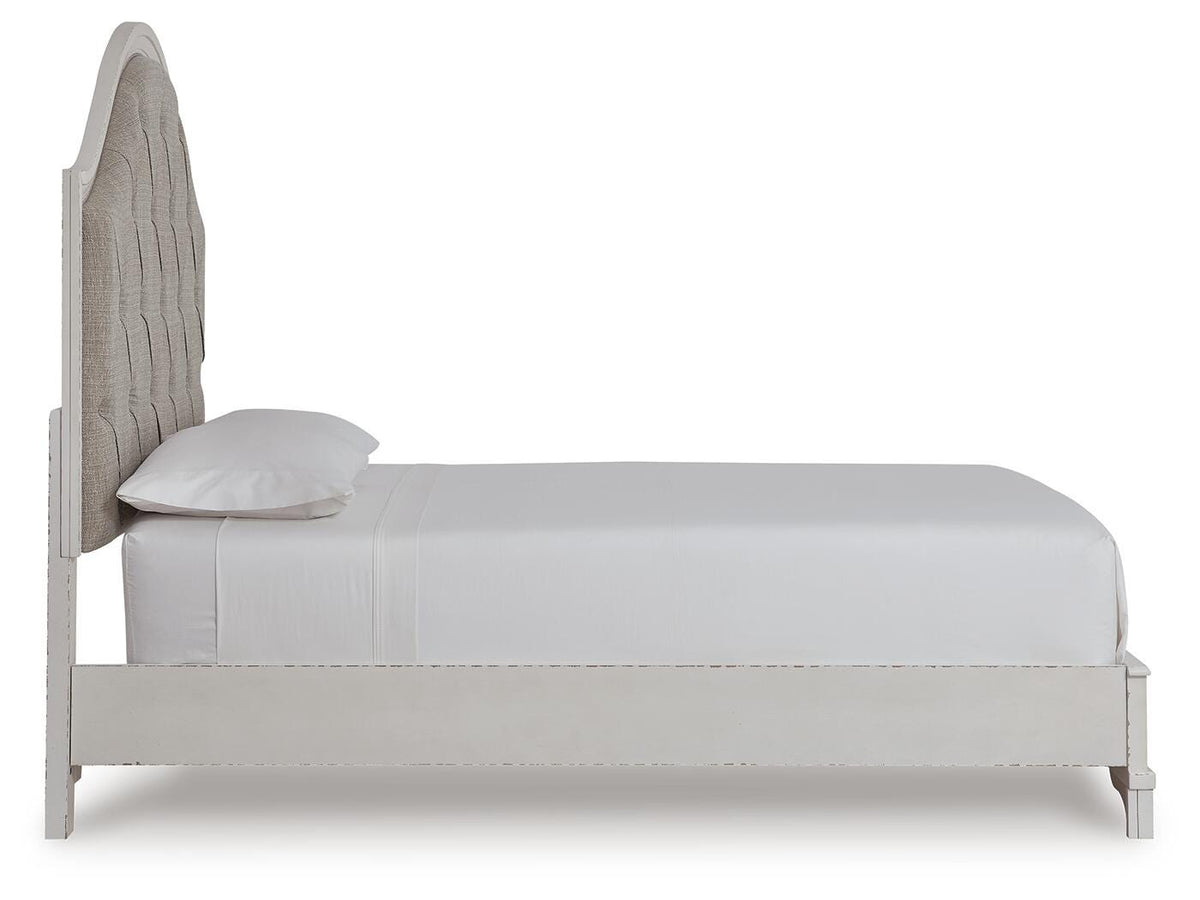 Blendon Queen Upholstered Panel Bed in Rustic Brown, side view