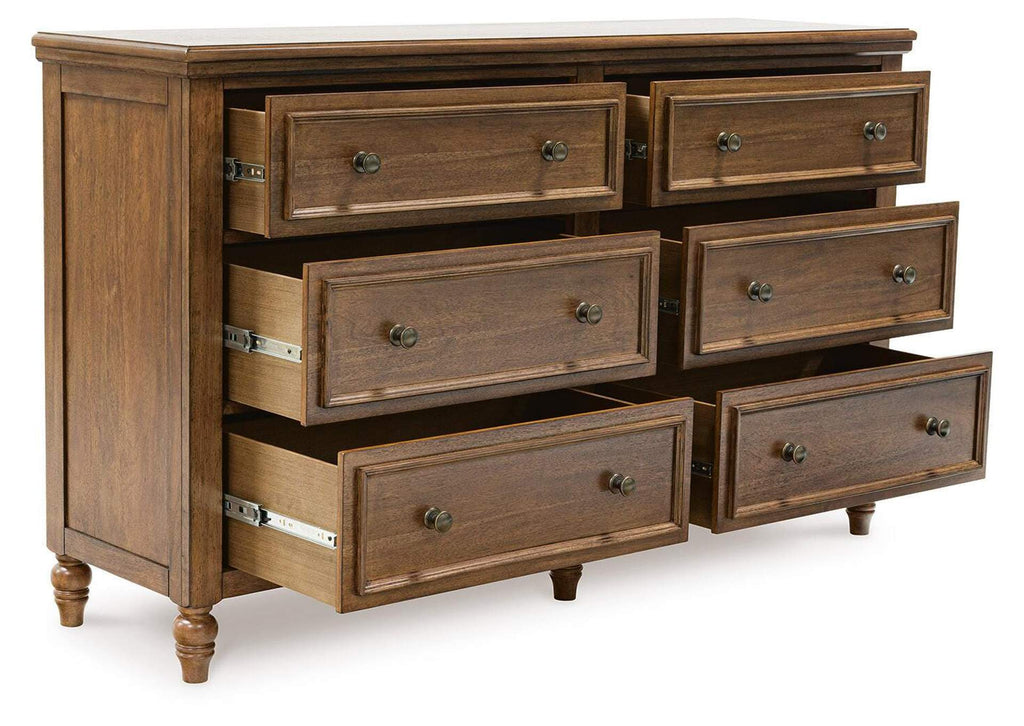 Sturlayne California King Upholstered Panel Bed, Dresser and 2 Nightstands angled view