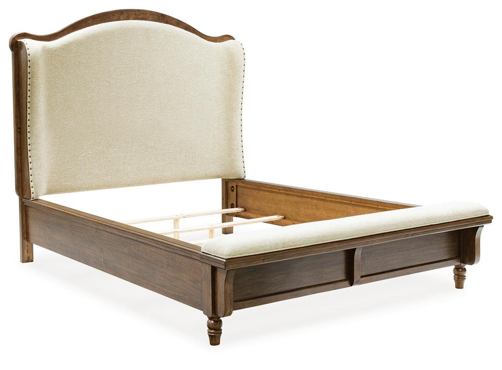 Sturlayne Queen Upholstered Panel Bed in Brown, angle view