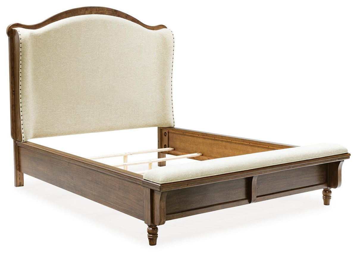 Sturlayne Queen Upholstered Panel Bed in Brown, angle view