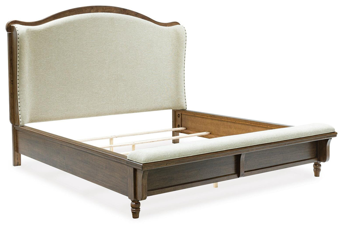 Sturlayne King Upholstered Panel Bed in Brown, angle view