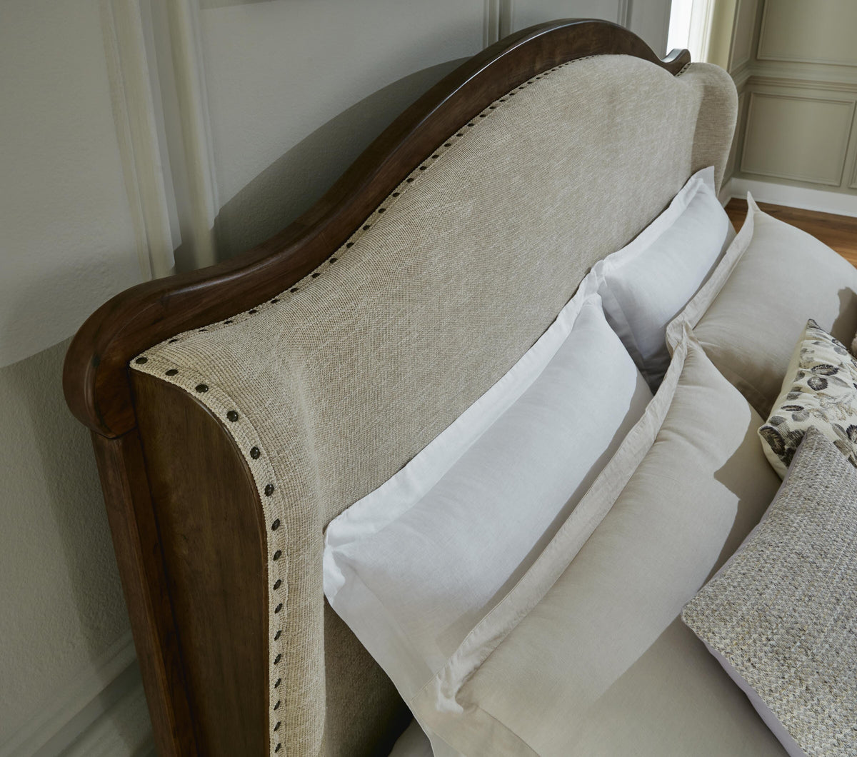 Sturlayne Queen Upholstered Panel Bed in Brown, detail view