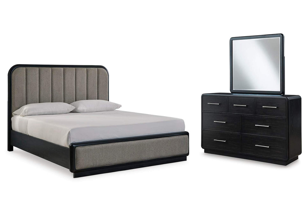 Rowanbeck California King Upholstered Panel Bed with Mirrored Dresser