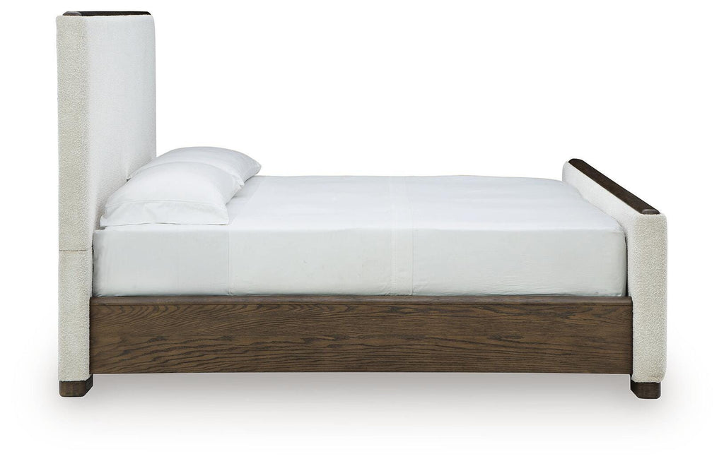 Radkin King Upholstered Panel Bed in Burnished Brown, side view
