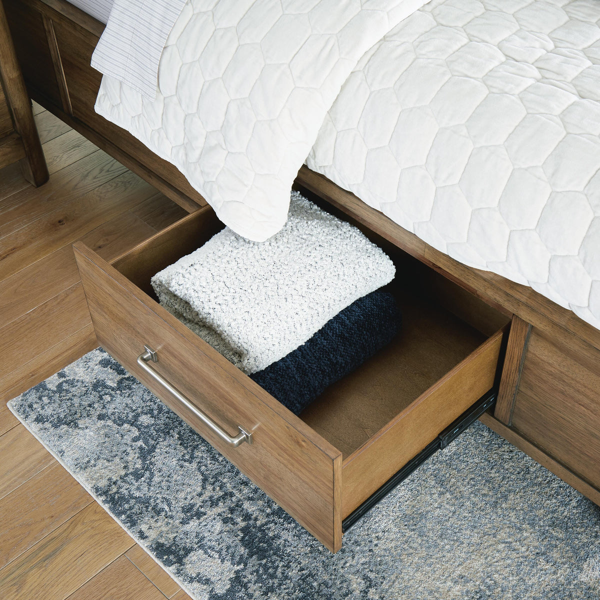 Cabalynn California King Panel Bed with Storage in Light Brown, detail view