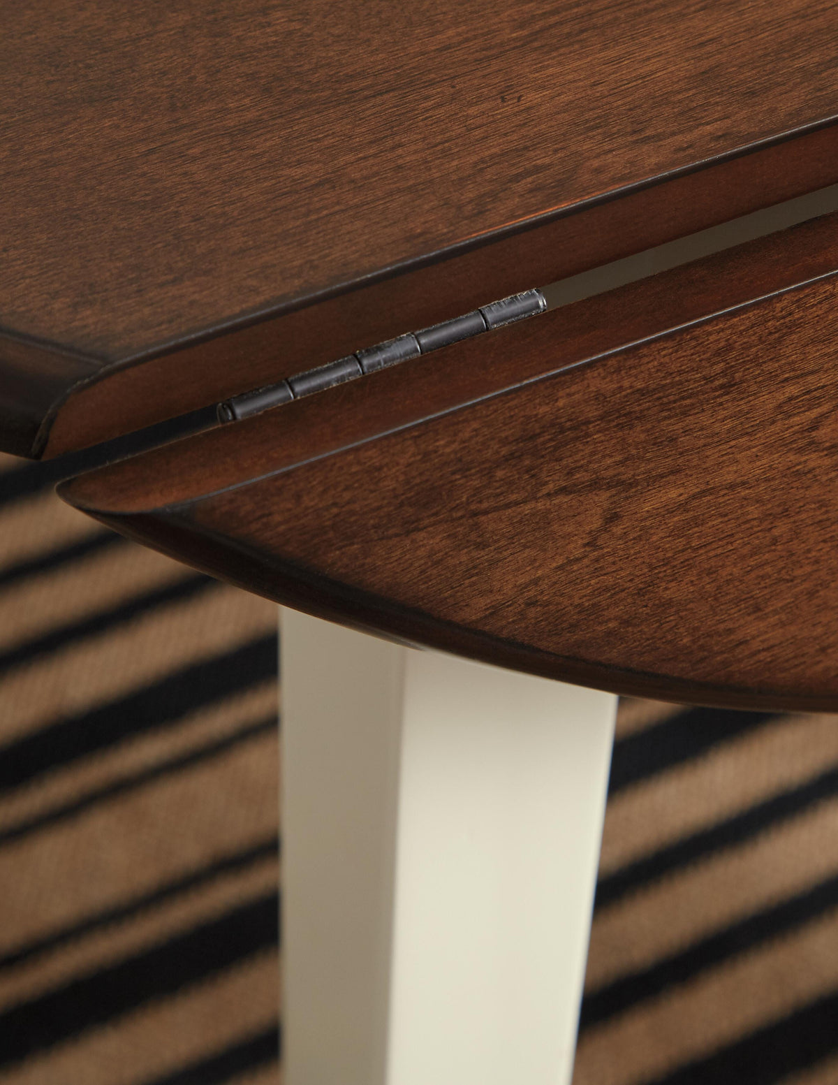Woodanville Dining Drop Leaf Table in Cream/Brown, detail view