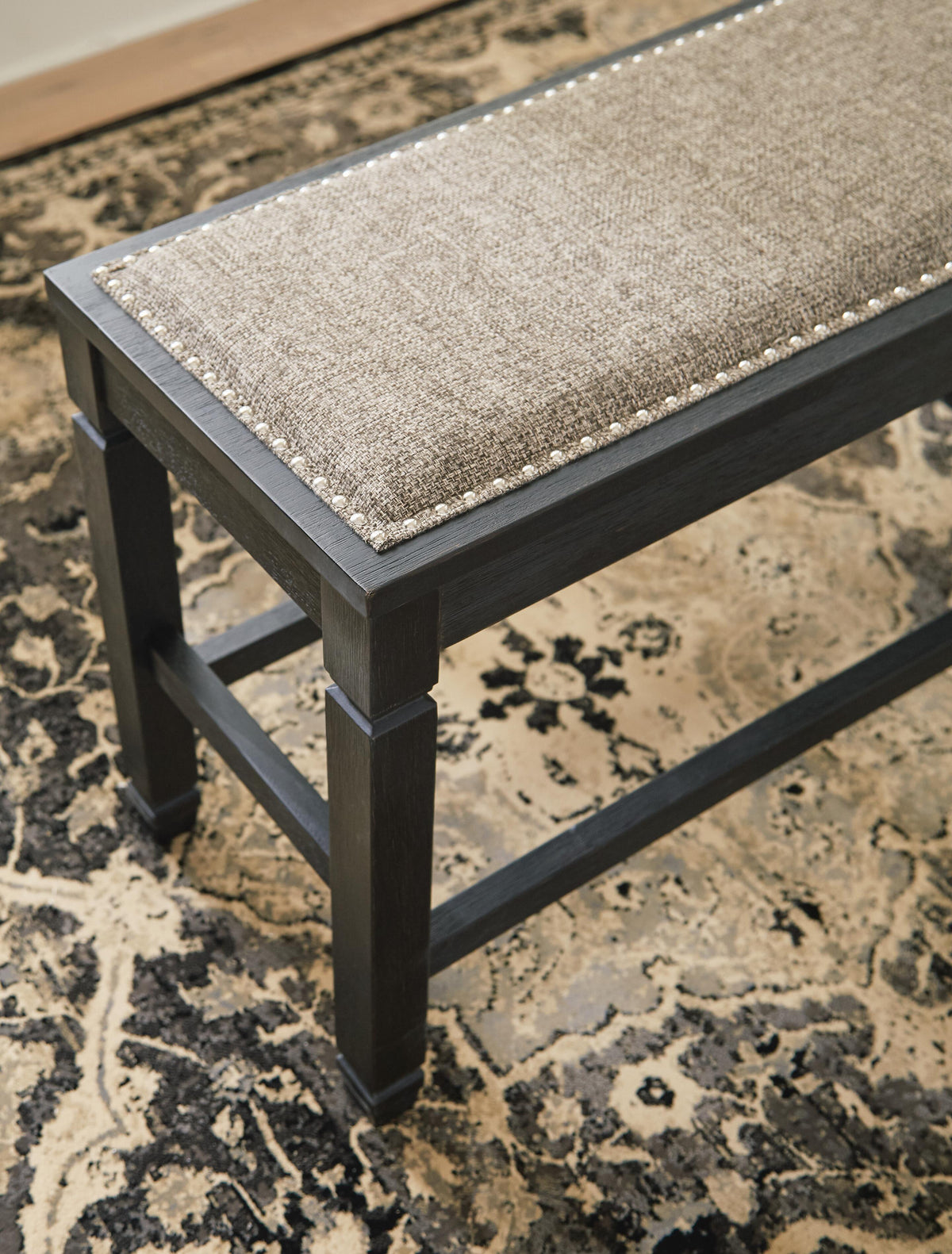 Tyler Creek Counter Height Dining Bench in Antique Black, detail view