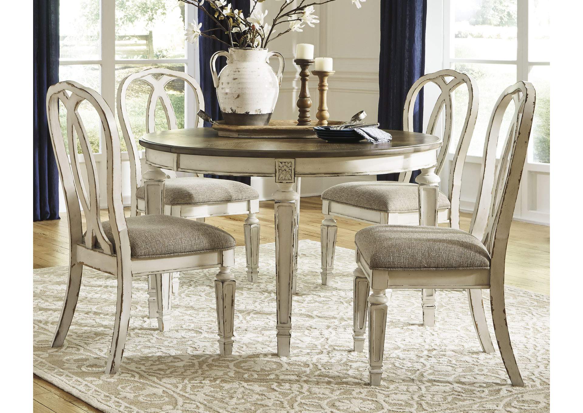 Realyn Extendable Dining Table and 4 Ribbon Back Chairs room view