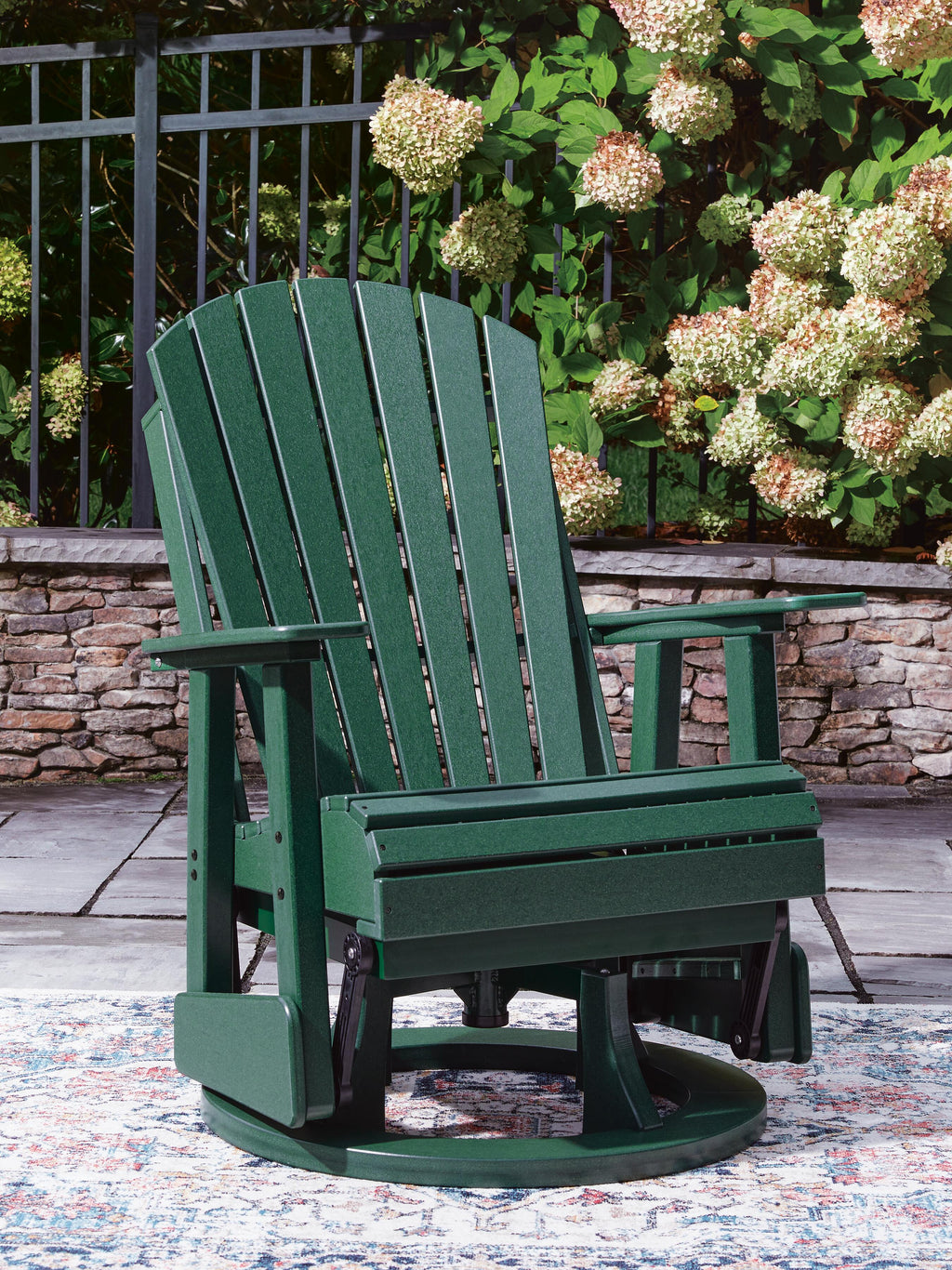 Shell Beach Outdoor Swivel Glider Chair in Green, lifestyle view