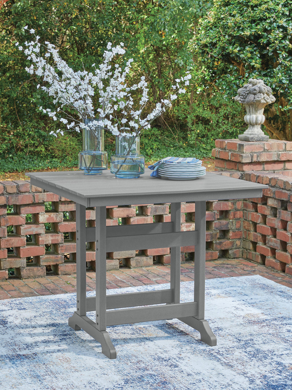 Sanctuary Beach Outdoor Counter Height Dining Table in Dark Gray, lifestyle view