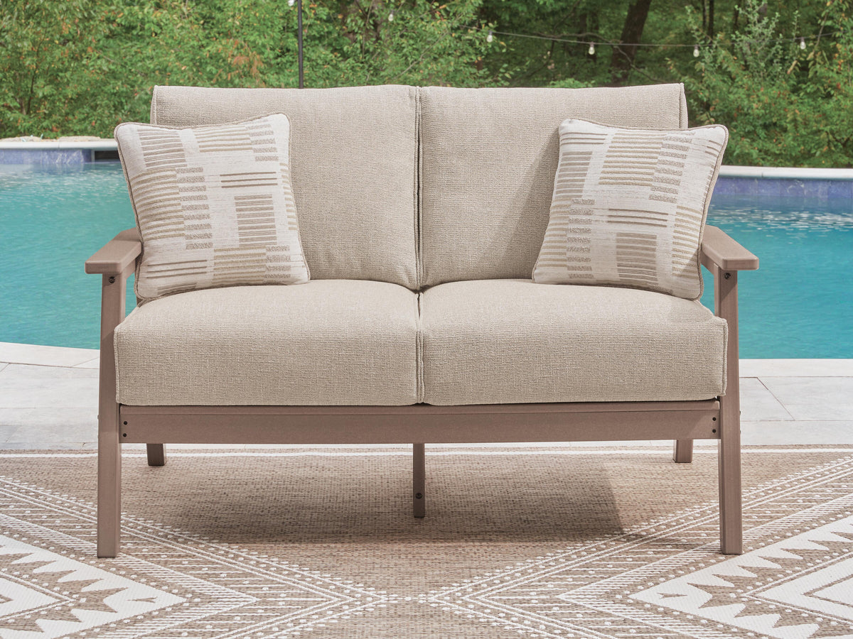 Grover Beach Outdoor Loveseat with Cushion in Driftwood, lifestyle view
