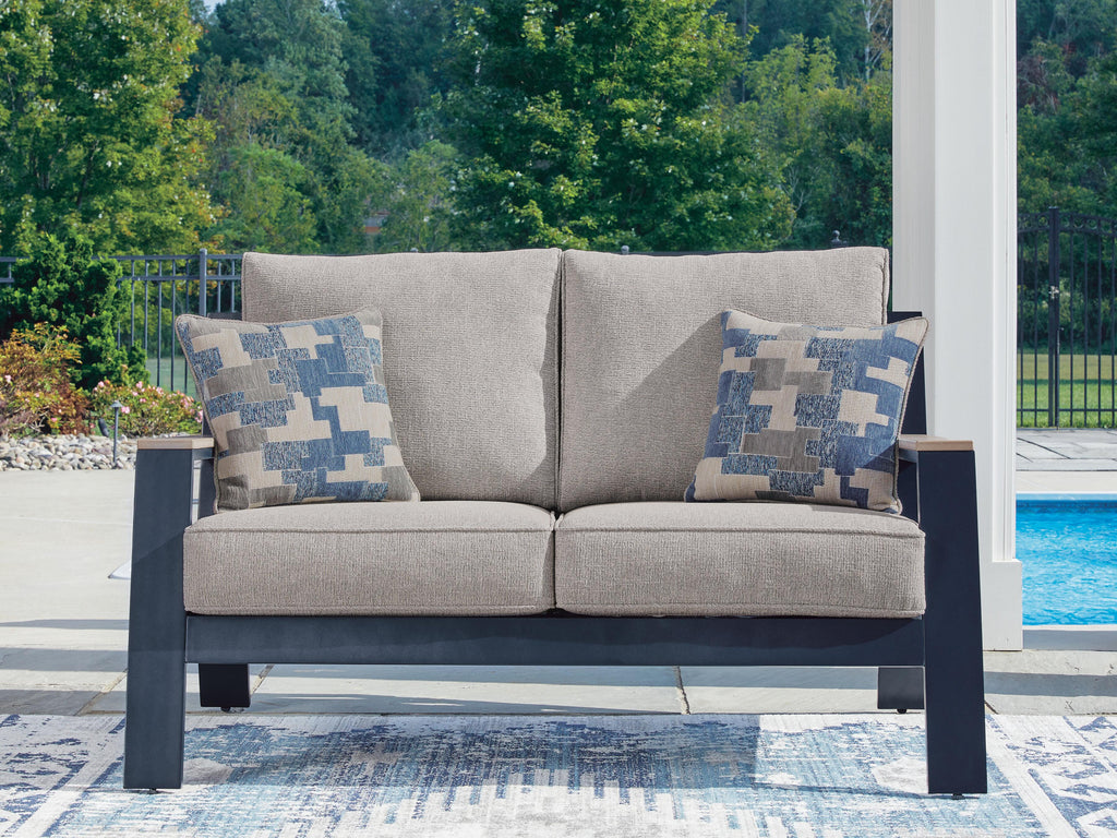 East Beach Outdoor Loveseat with Cushion in Navy Blue/Driftwood, lifestyle view