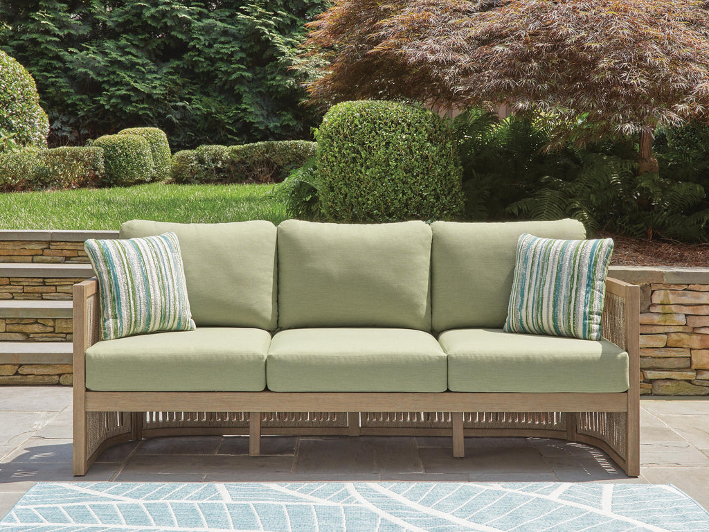 Serena Shores Outdoor Sofa with Cushion in Beige/Green, lifestyle view