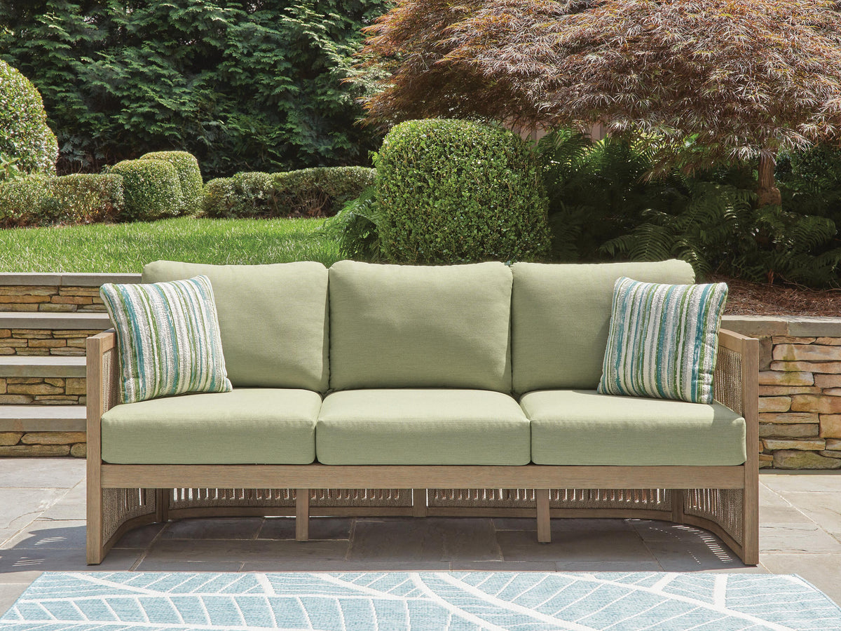 Serena Shores Outdoor Sofa with Cushion in Beige/Green, lifestyle view