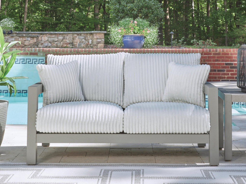 Hurley Park Outdoor Loveseat with Cushion in Gray, lifestyle view