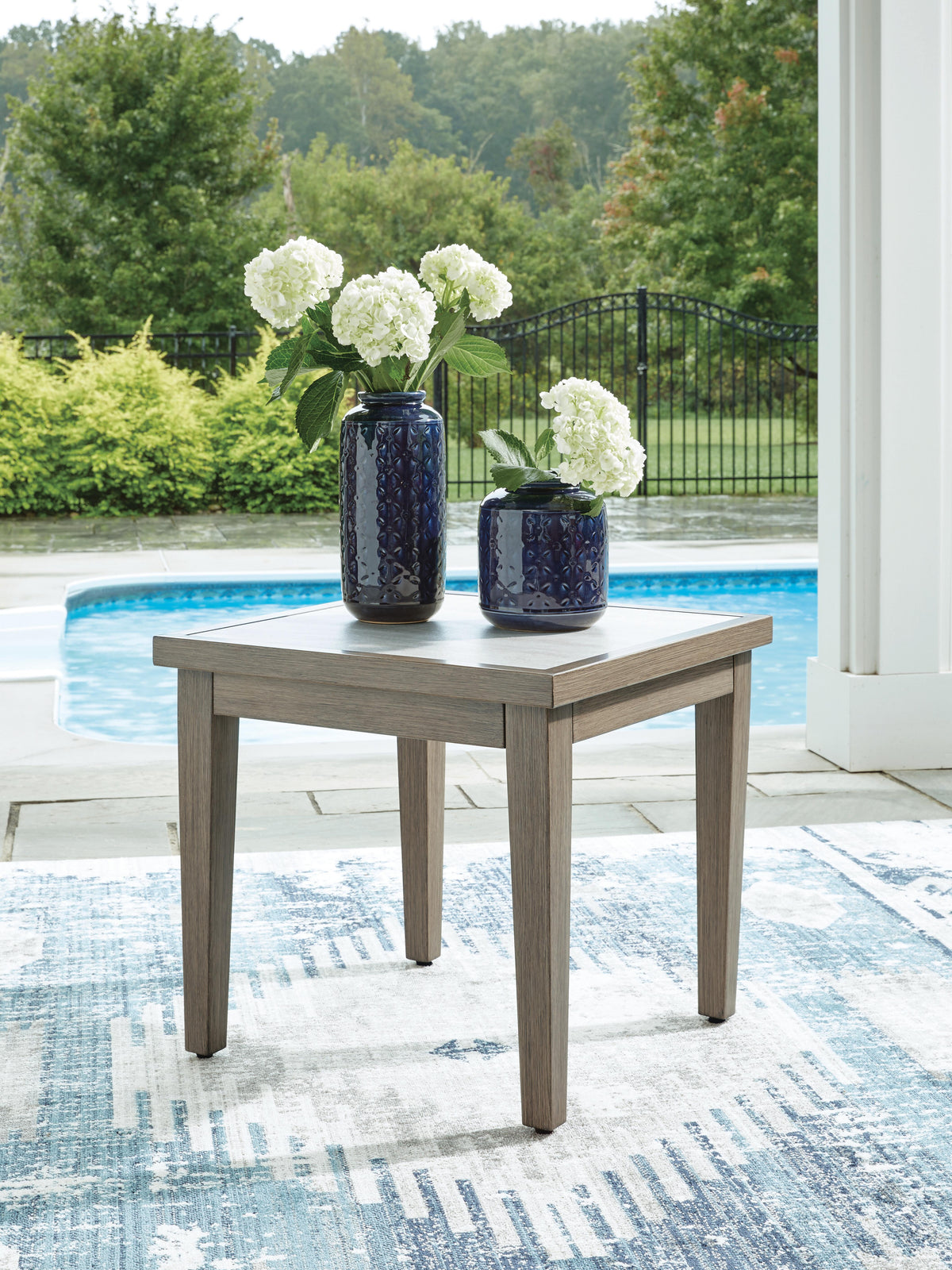 Rainier Ranch Outdoor End Table in Brown/Beige, lifestyle view