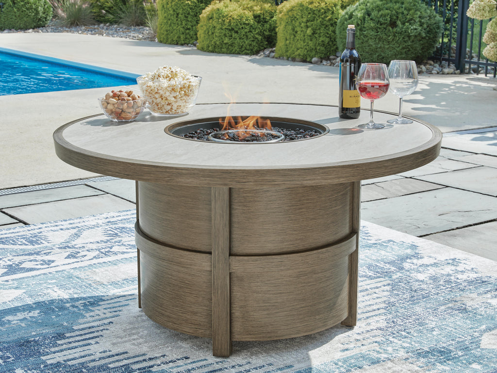Rainier Ranch Fire Pit Table in Beige, lifestyle view