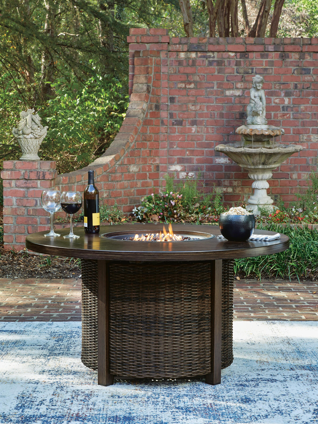 Monterey Point Outdoor Fire Pit Table in Dark Brown, lifestyle view