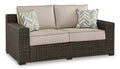 Coastline Bay Outdoor Loveseat with Cushion in Brown, angle view