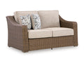 Laguna Heights Outdoor Loveseat with Cushion in Beige, angle view