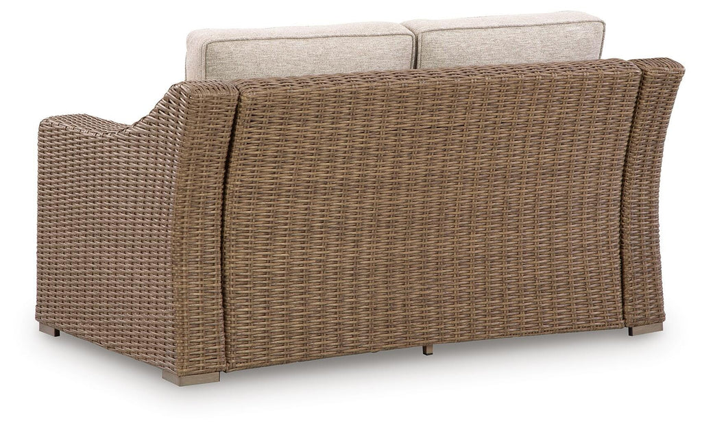 Laguna Heights Outdoor Loveseat with Cushion in Beige, back view