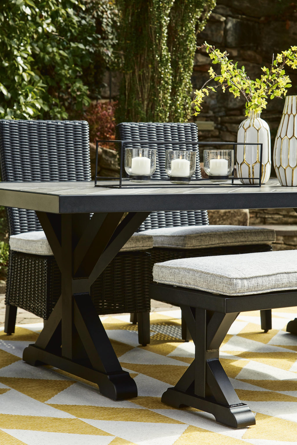 Beachcroft Outdoor Dining Table in Black/Light Gray, lifestyle view