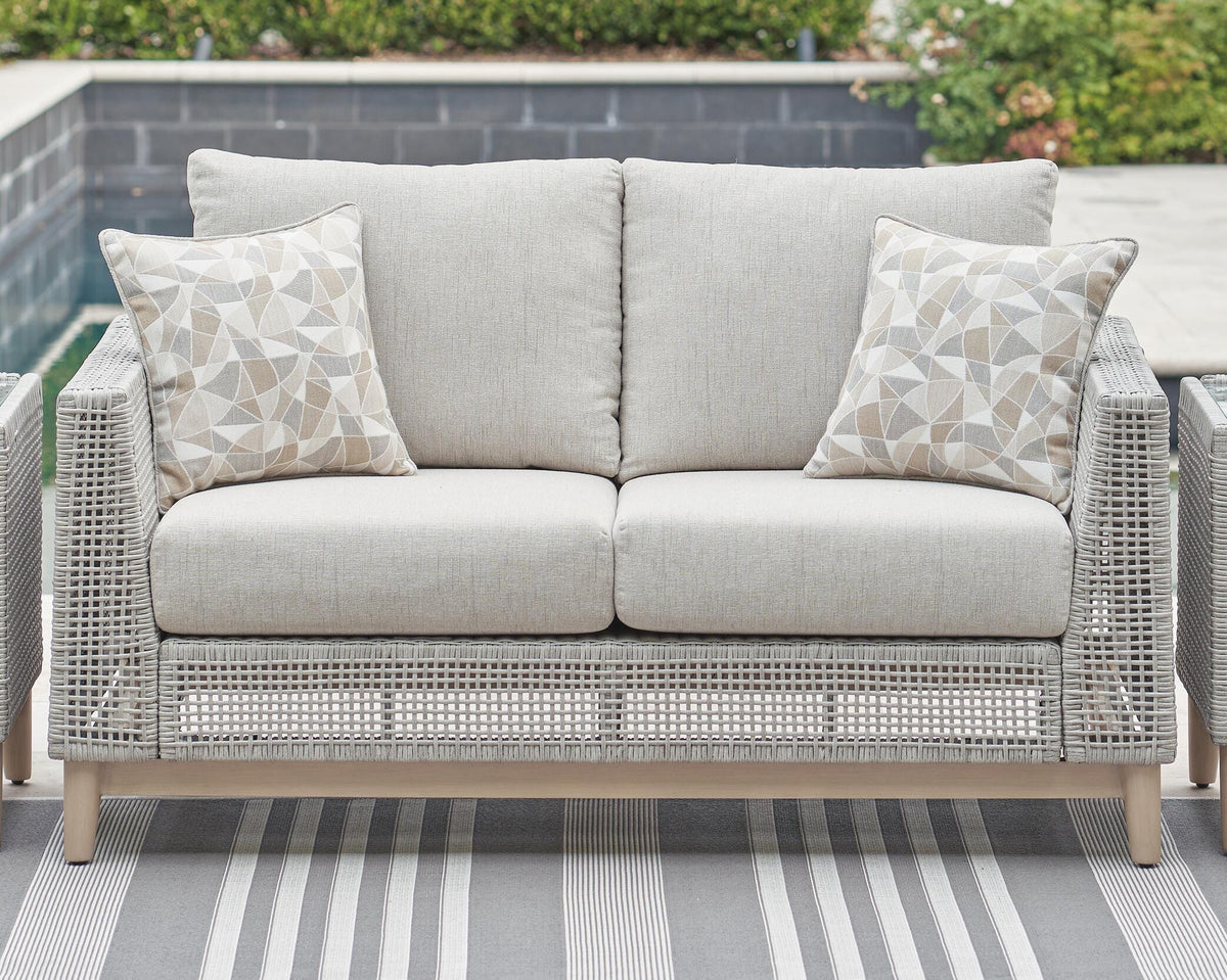 Seton Creek Outdoor Loveseat with Cushion in Gray, lifestyle view