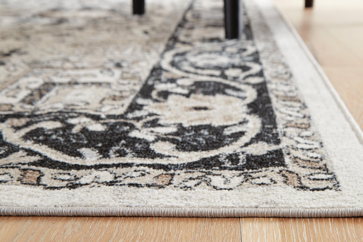 Gregmoore 5'2" x 6'10" Washable Rug in Multi, detail view