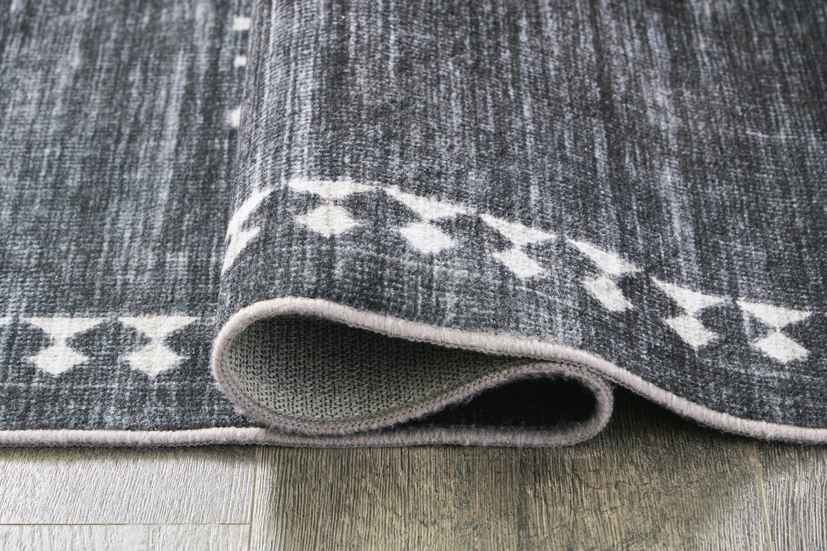 Arloman 5' x 7' Washable Rug in Black/Cream/Gray, detail view