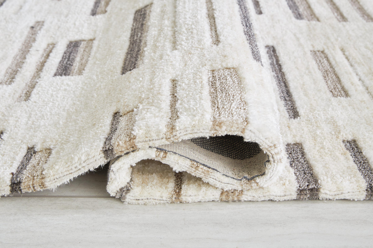 Leesdale 5' x 7' Rug in Ivory/Brown/Black, detail view