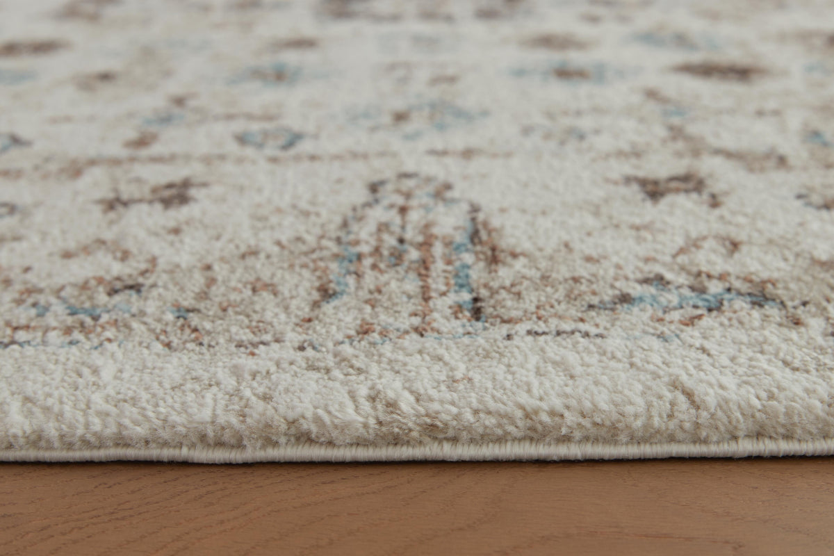 Jossler 5' x 7' Rug in Ivory/Brown/Teal, detail view