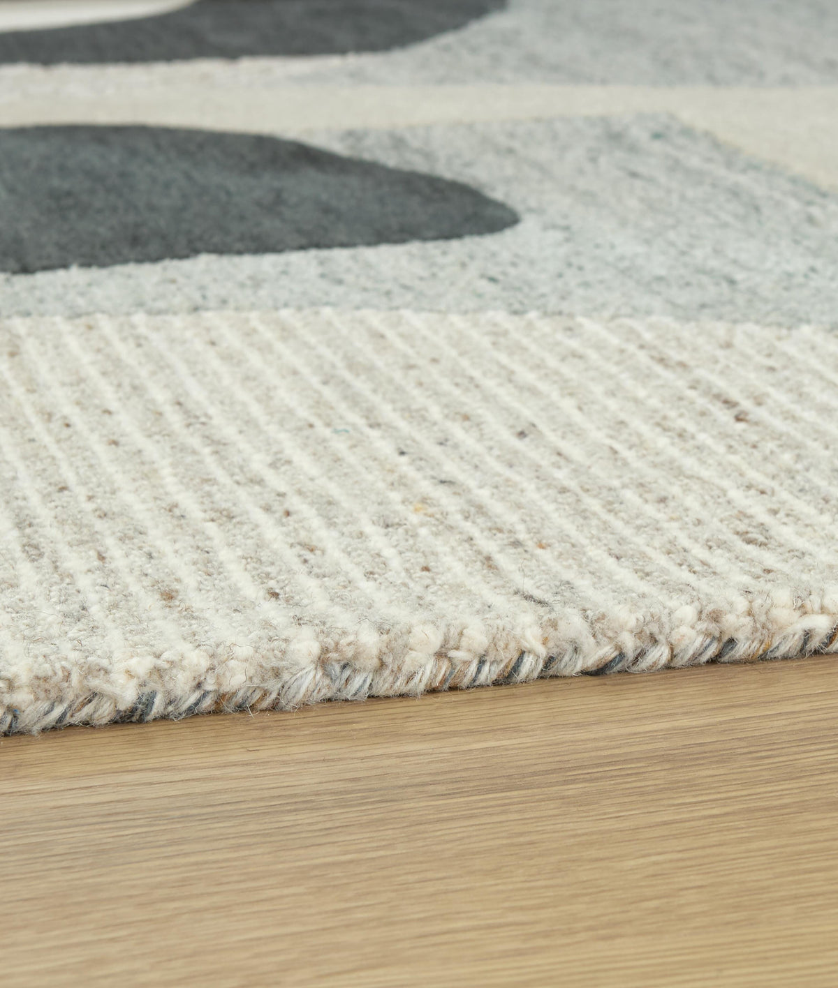Edrickhill 5' x 7' Rug in Grayish Teal/Taupe/Cream, detail view