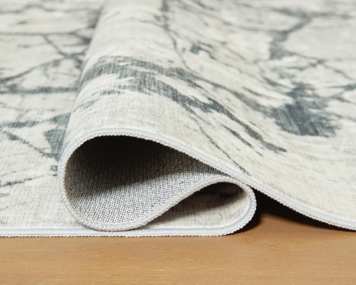 Tobinbury Washable 5' x 7' Area Rug in Gray, detail view