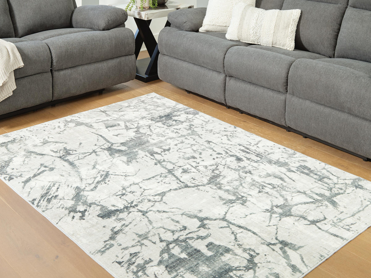 Tobinbury Washable 5' x 7' Area Rug in Gray, lifestyle view