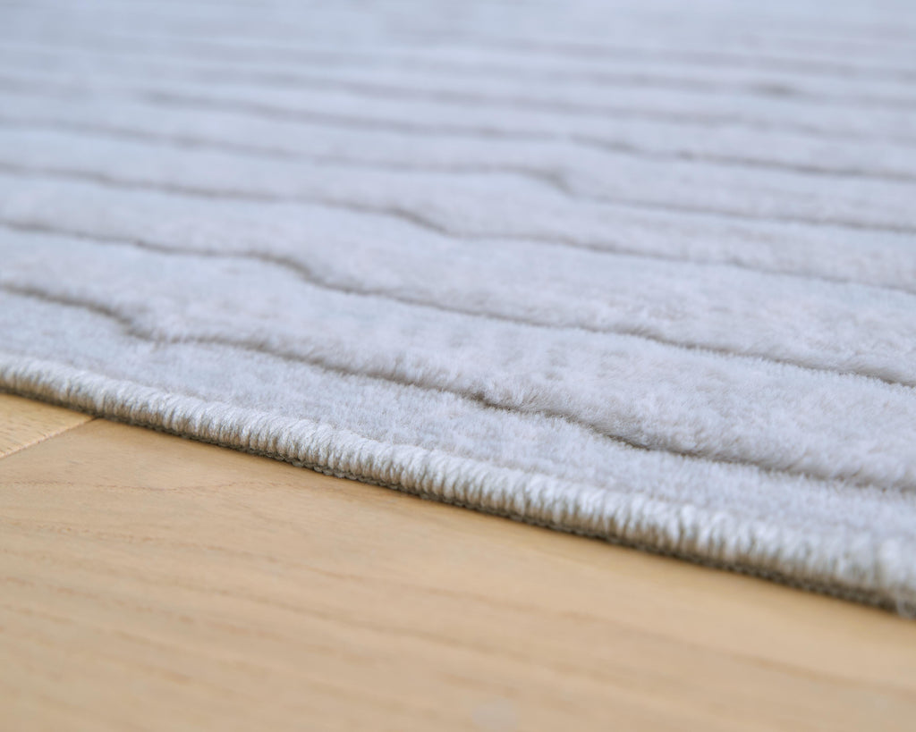 Worthley Washable 5' x 7' Area Rug in Gray, detail view