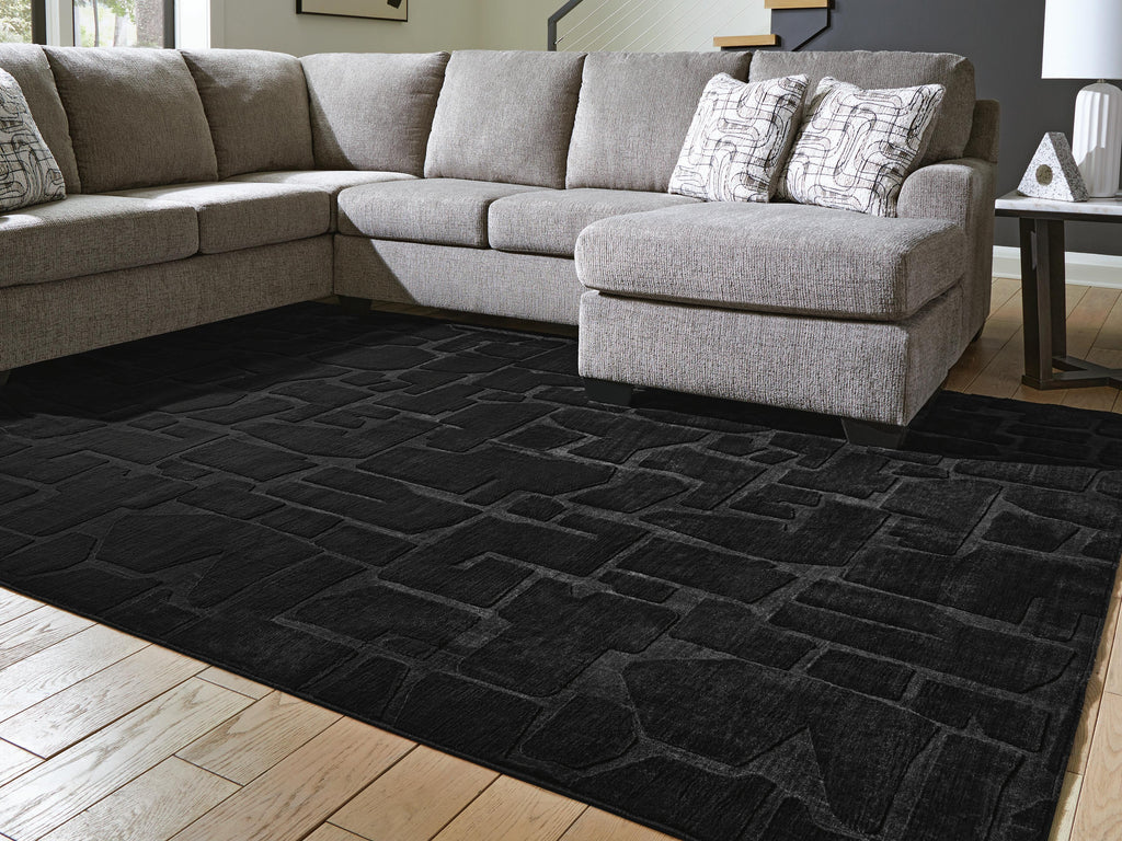 Gibbswell Washable 8' x 10' Area Rug in Black, lifestyle view