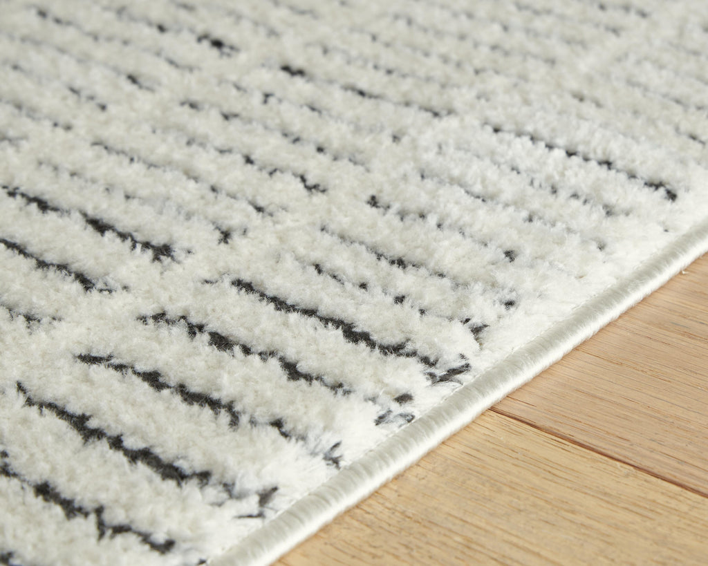 Turinwith 5'3" x 7' Area Rug in Ivory/Black, detail view