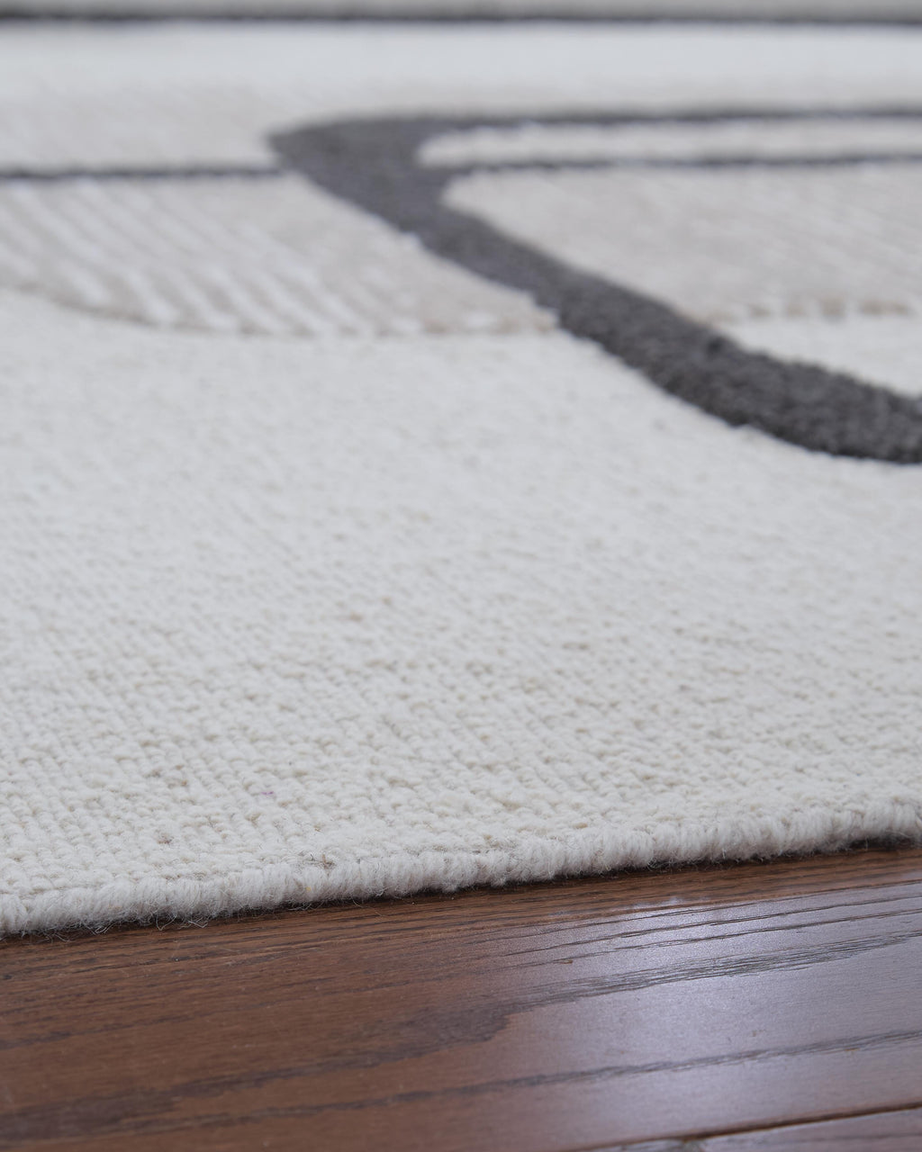Davismour 5' x 7' Area Rug in Ivory/Taupe/Charcoal, detail view
