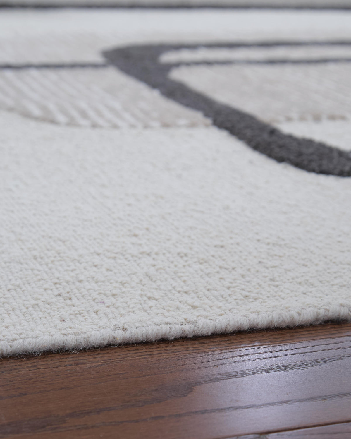 Davismour 5' x 7' Area Rug in Ivory/Taupe/Charcoal, detail view