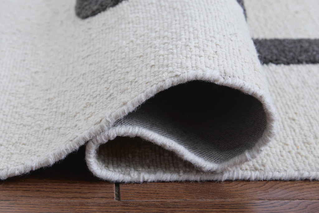 Davismour 5' x 7' Area Rug in Ivory/Taupe/Charcoal, detail view
