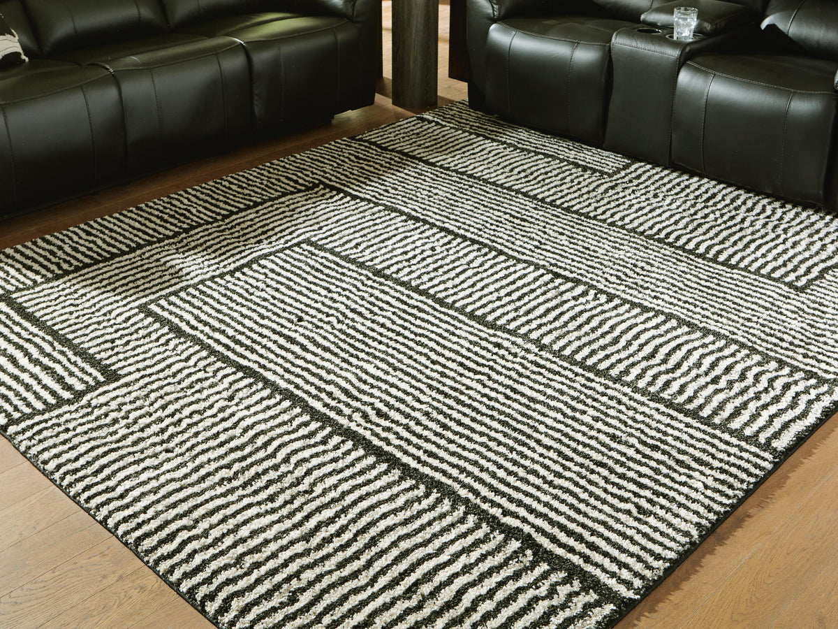 Kurtmen 7'10" x 9'10" Area Rug in Black/Ivory, lifestyle view