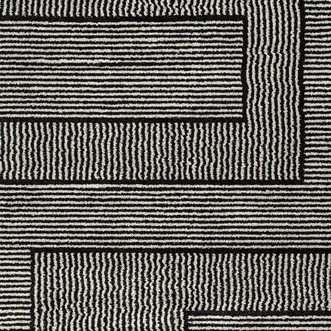 Kurtmen 7'10" x 9'10" Area Rug in Black/Ivory, fabric swatch